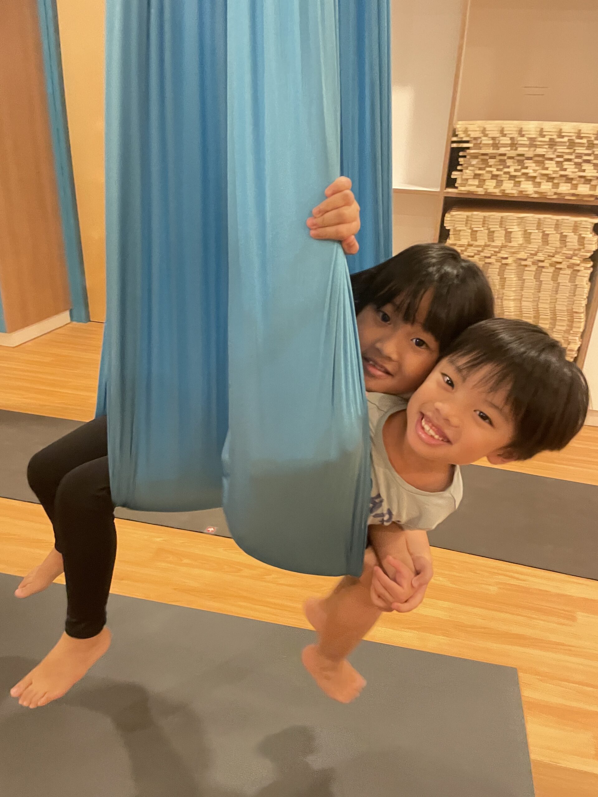 Children enjoying aerial yoga