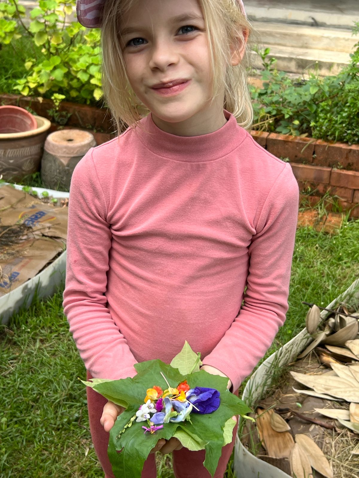 Child with flowers in garden mindfulness camp