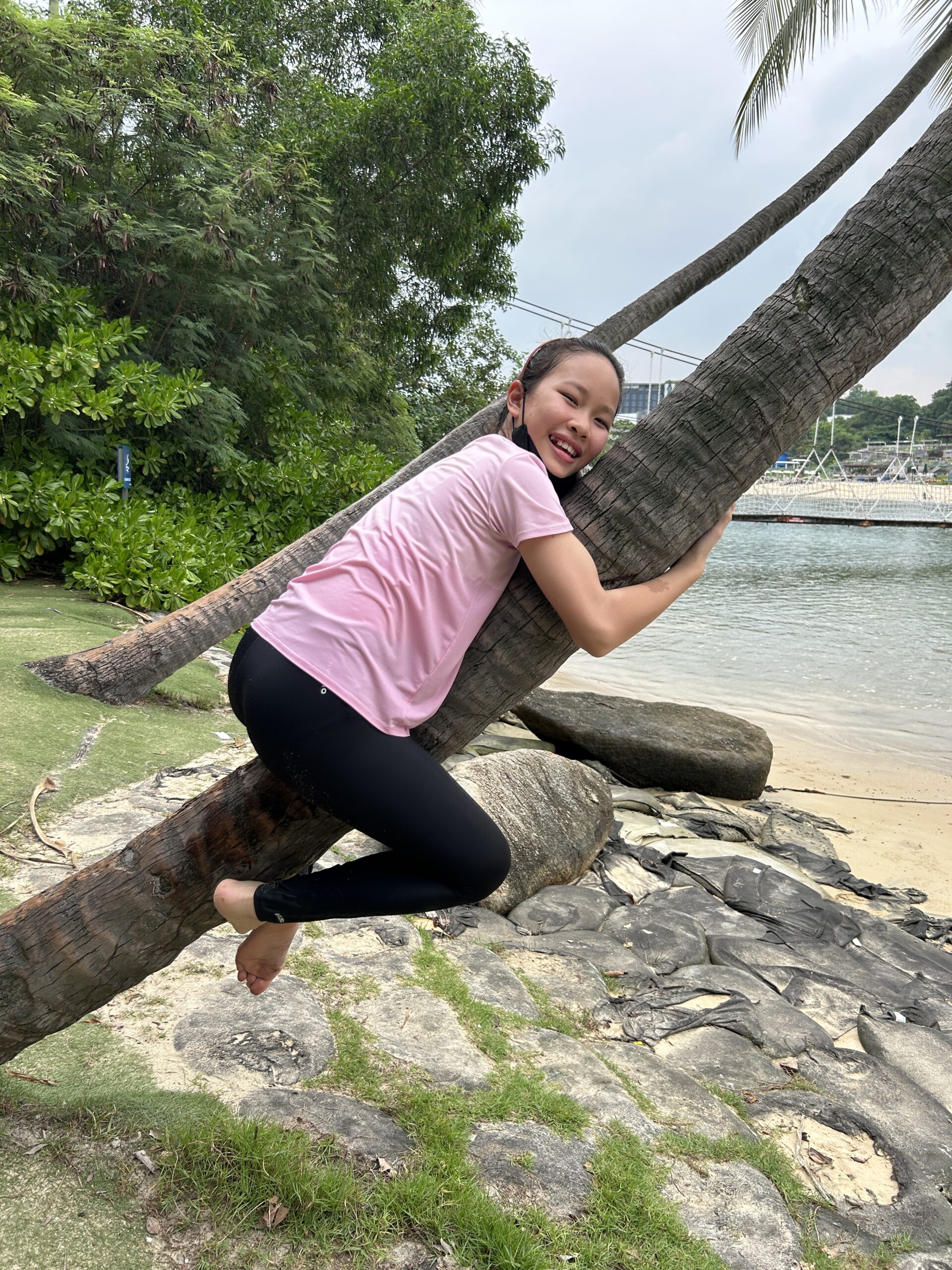 Girl having fun at the beach at Singapore mindfulness holiday camp June 2026