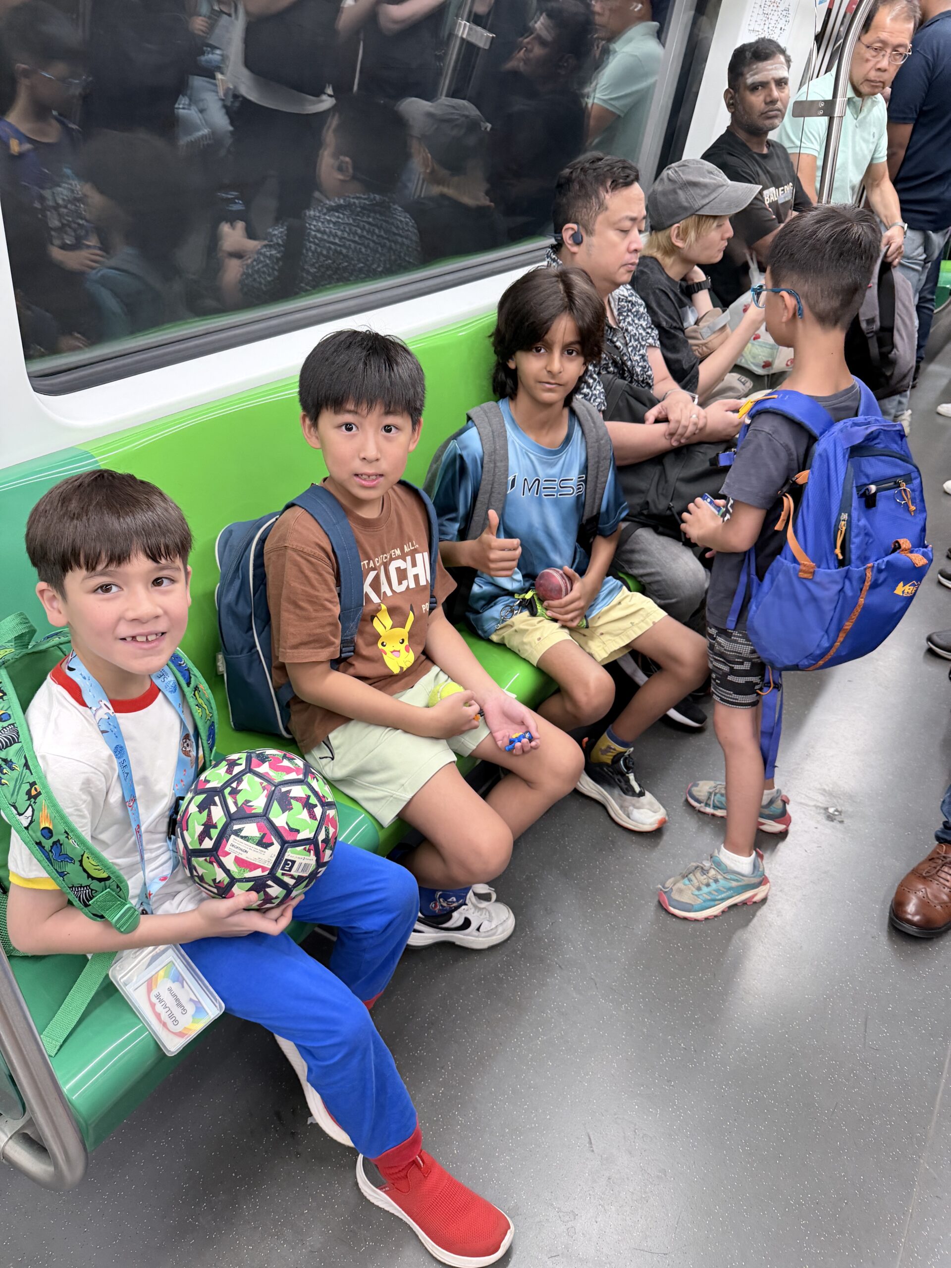 Children learning to navigate public transport at Singapore holiday camp