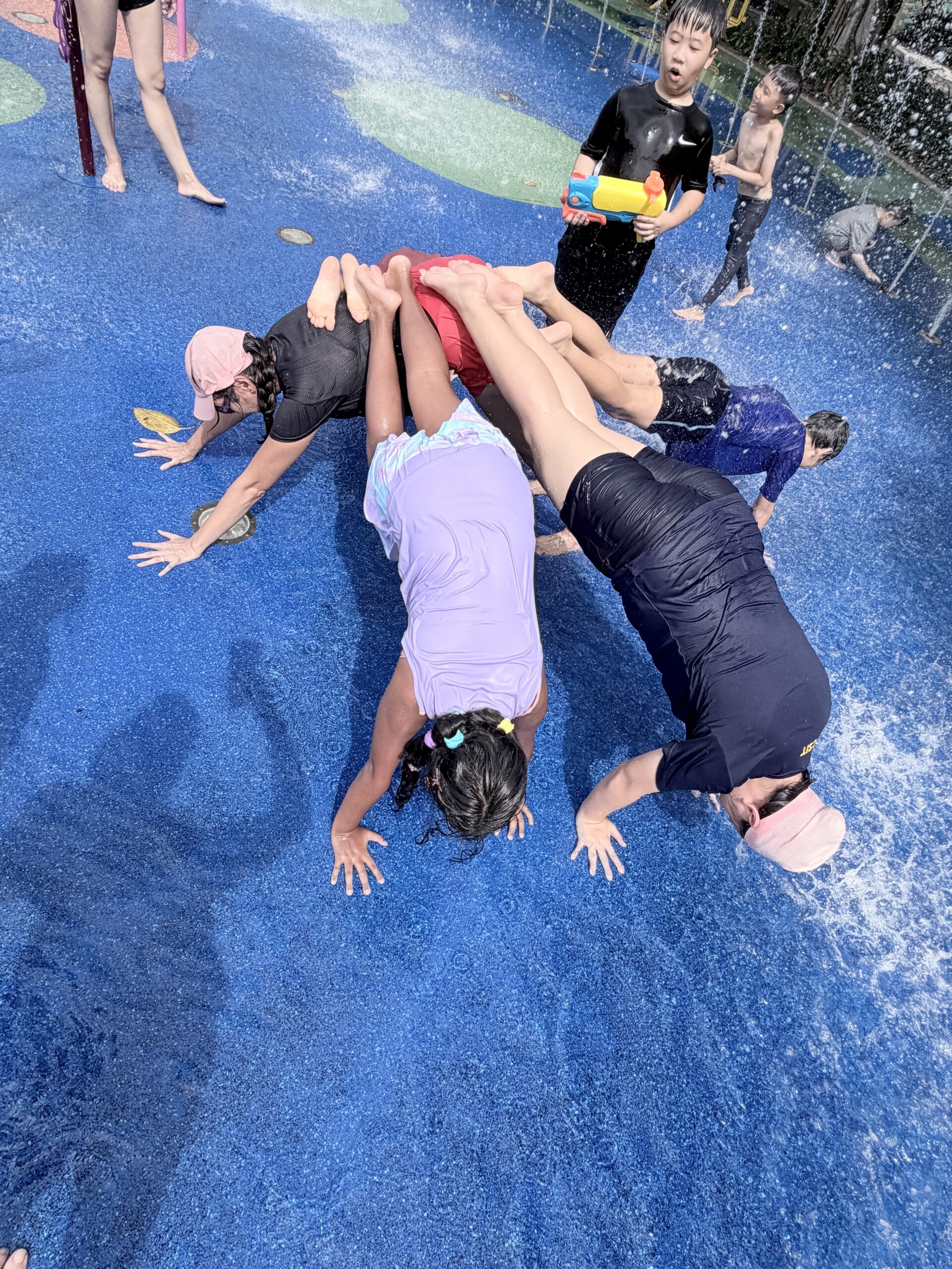 Children enjoying water play at Singapore kids holiday camp