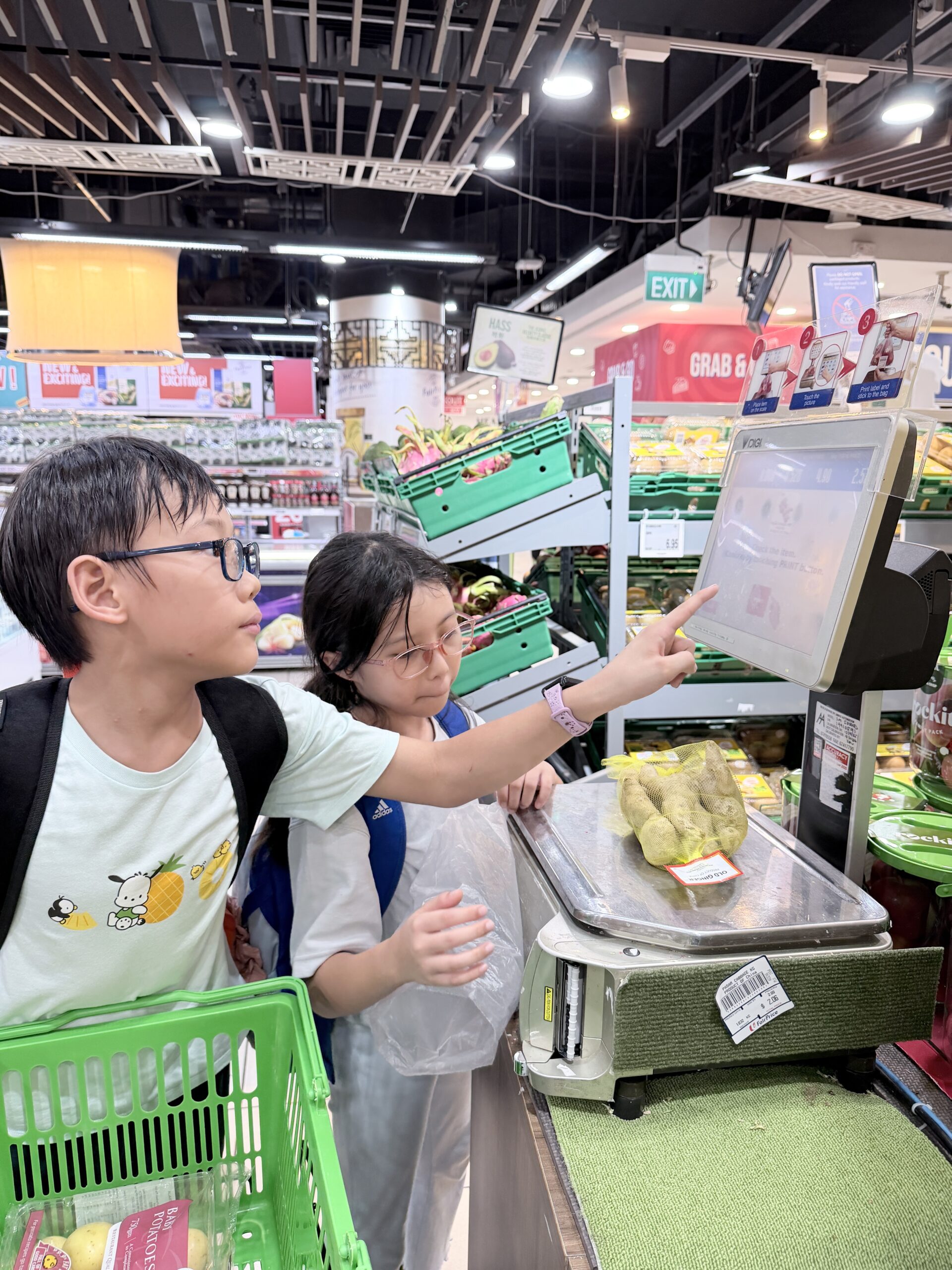 Children grocery shopping together at Singapore mindfulness camp